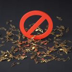 a pile of musical notes and a red sign