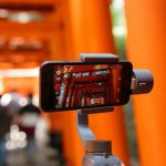 person taking picture of temple