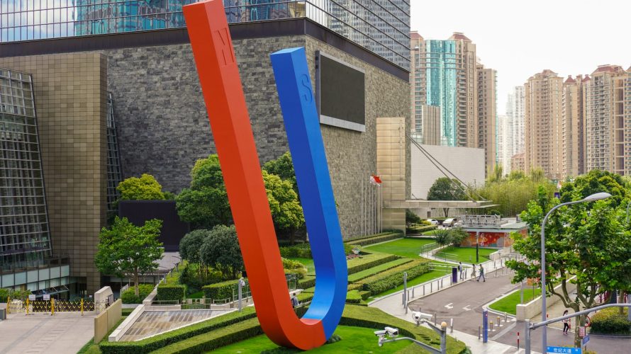 brown concrete building near green trees during daytime
