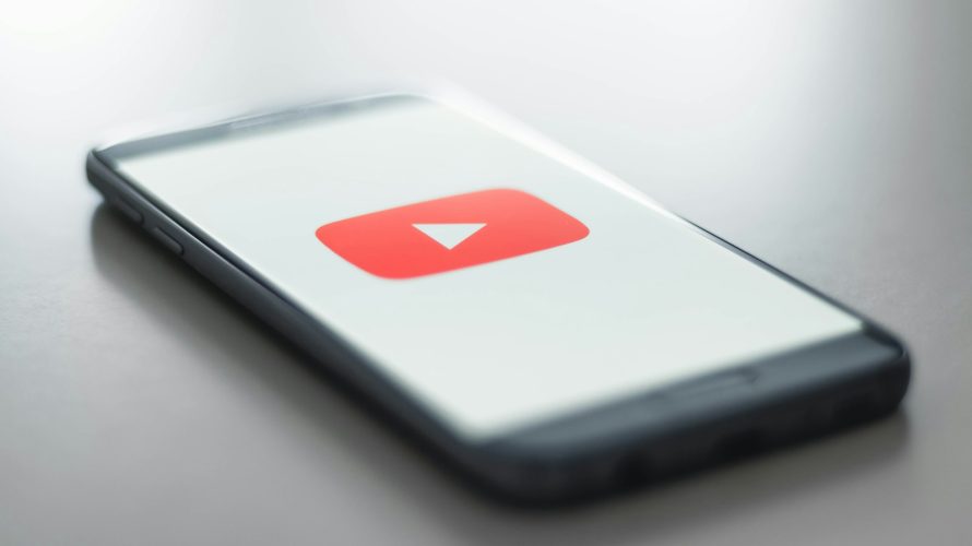 a close up of a cell phone with a youtube logo on it
